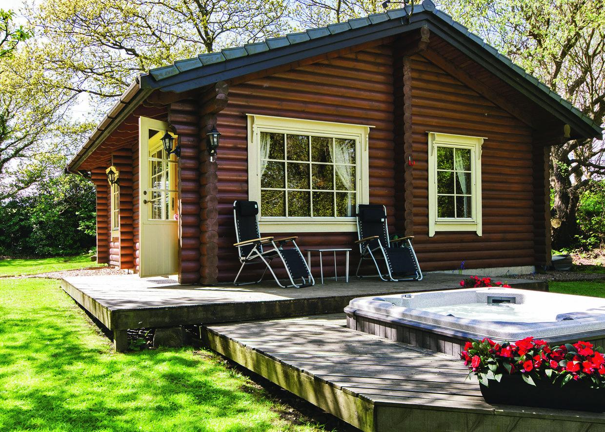 The exterior and hot tub at Faweather Grange