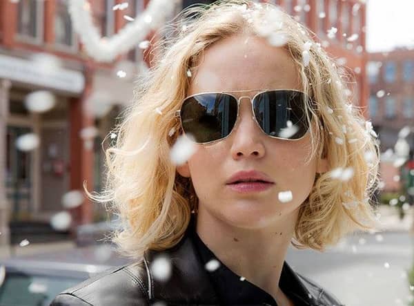 Jennifer Lawrence wearing gold-framed aviators in the movie Joy