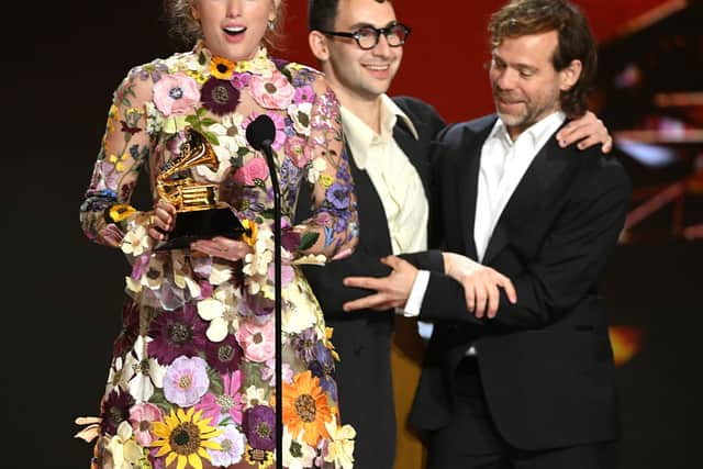 Taylor Swift, Jack Antonoff, and Aaron Dessner accept the Album of the Year award for âFolklore onstage during the 63rd Annual GRAMMY Awards at Los Angeles Convention Center on March 14, 2021 in Los Angeles, California. (Photo by Kevin Winter/Getty Images for The Recording Academy)