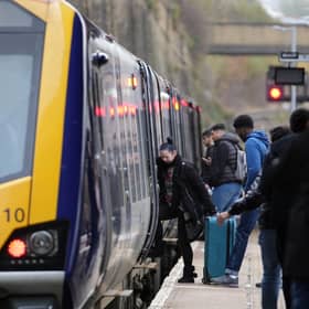 Passengers board train.