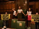Handout photo taken with permission from the twitter feed of Extinction Rebellion of protesters who have superglued themselves around the Speaker's chair in the House of Commons chamber, as they call for a Citizen's Assembly. Picture date: Friday September 2, 2022.