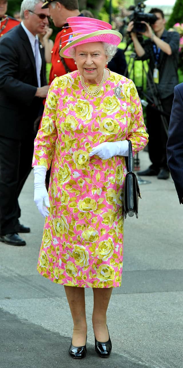 WINNIPEG, CANADA - JULY 3:  Queen Elizabeth II walks out of Government House to unveil a statue of herself on July 3, 2010 in Winnipeg, Canada. The Queen and Duke of Edinburgh are on an eight day tour of Canada, starting in Halifax and finishing in Toronto, to celebrate the centenary of the Canadian Navy and to mark Canada Day on July 1st. On July 6th the royal couple will make their way to New York where the Queen will address the UN and visit Ground Zero. (Photo by John Stillwell - WPA Pool/Getty Images)