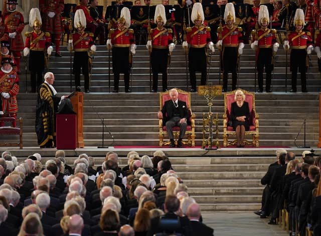 King Charles III and the Queen Consort listen to Speaker of the House of Lords Lord McFall of Alcluith (left) at Westminster Hall. Credit: PA