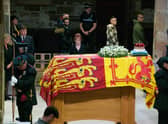Members of the public file past the coffin of Queen Elizabeth II in St Giles' Cathedral, Edinburgh, as it lies at rest. Picture date: Monday September 12, 2022.