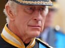 King Charles III follows the coffin of Queen Elizabeth II as it travels inside Windsor Castle on September 19. 