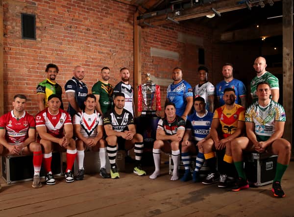 The 16 captains with the Rugby League World Cup Trophy ahead of first round of fixtures