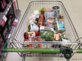 A shopping trolley is pictured at a Waitrose supermarket in London. 