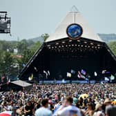 Crowds of festival-goers watch Tom Odell perform on the Pyramid Stage during day three of Glastonbury Festival 2019