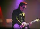 Andy Taylor of Duran Duran performs on stage during the first London date of their UK tour at Wembley Arena on April 13, 2004.  