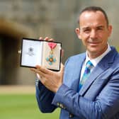  Martin Lewis poses with his CBE (Getty Images)