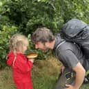 Jim Parums and his daugher foraging a mushroom - the family save £100 a week by foraging for all their meals. 