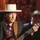 Bob Dylan has issued a rare public apology for selling books with automated signatures.  