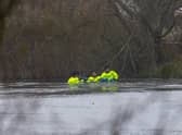 Rescue teams searching the freezing lake in Solihull for survivors.
