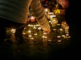 An organised candelit vigil at Babbs Mill Lake where a group of children fell through the ice on Sunday. Three of those children have died while a fourth, aged six, is fighting for his life in hospital.