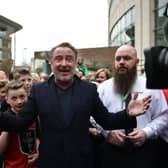 Michael Flatley, star of Riverdance and Lord of the Dance is mobbed by fans as he makes an appearance during the opening day of the World Irish Dancing Championships at the Waterfront Hall on April 10, 2022 in Belfast