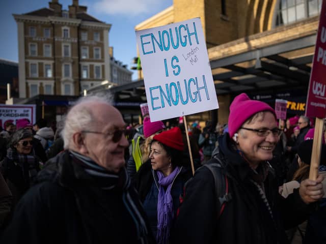 LONDON, ENGLAND - NOVEMBER 30: Protesters take part in a union rally on November 30, 2022 in London, England. Representatives of National Education Union (NEU), Communication Workers Union (CWU) and the public-service union Unison joined a rally by the University and College Union (UCU) amid strike action by staff at educational institutions across the UK. (Photo by Carl Court/Getty Images)