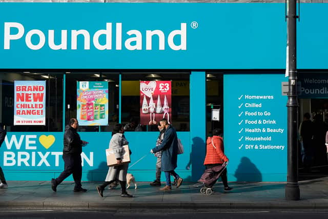 Pedestrians walk past a Poundland shop in Brixton, south London on February 7, 2022. - The Bank of England said Britain's annual inflation rate would peak at 7.25 percent in April, compared with 5.4 percent last December, which was already near a 30-year high. (Photo by Niklas HALLE'N / AFP) (Photo by NIKLAS HALLE'N/AFP via Getty Images)