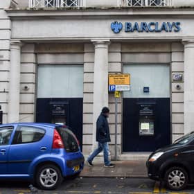 A man walks past a Barclays bank, in the Channel island's port capital Saint Helier, on December 11, 2022. (Photo by Sebastien SALOM-GOMIS / AFP) (Photo by SEBASTIEN SALOM-GOMIS/AFP via Getty Images)