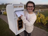 Matilda Handy, 9, and mum, Leanne Handy 45 with their letter box to heaven, in Gedling Crematorium, which allows grieving members of the public to write a letter to their loved ones who have passed away.  (Picture credit by SWNS)
