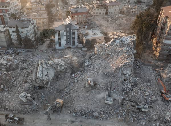 An aerial view of work machines and diggers at the site of collapsed buildings on February 16, 2023 in Hatay, Turkey