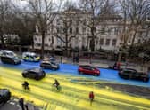 The Ukraine flag painted on the road outside the Russian Embassy in London (Photo: Led by Donkeys)