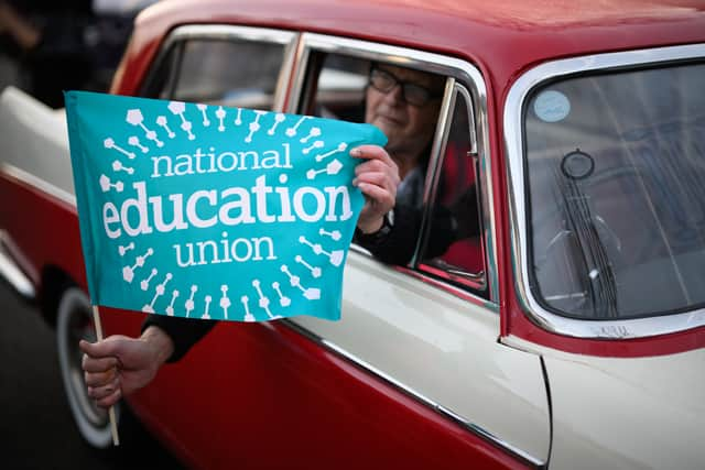 A driver supporting the NEU strike action (Photo: Getty)