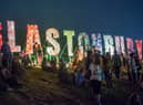 Festival-goers enjoy the atmosphere prior to the 2013 Glastonbury Festival at Worthy Farm. (Photo by Ian Gavan/Getty Images)