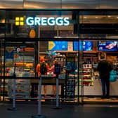 People purchase food in a branch of the bakery chain Greggs inside London Bridge station.