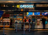 People purchase food in a branch of the bakery chain Greggs inside London Bridge station.