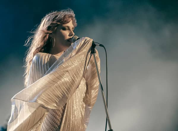 Riley Keough as Daisy Jones in Daisy Jones & The Six, performing in a style reminiscent of Stevie Nicks (Credit: Lacey Terrell/Prime Video)