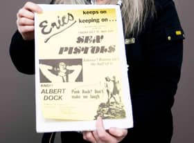 Claire Howell, music memorabilia consultant at Hansons Auctioneers, with the Sex Pistols poster.  