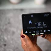 Samantha Pierre-Joseph shows her smart meter indicating that she is on a ‘Prepayment tariff’ in her house in London.