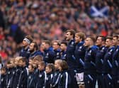 The Scotland team sing the national anthem during a Six Nations Rugby match at Murrayfield Stadium