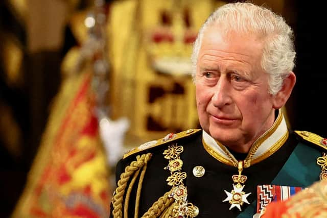 King Charles III gives recipients their honour or award in a special ceremony