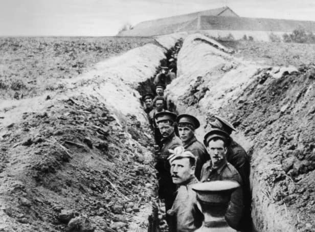 28th October 1914:  British soldiers lined up in a narrow trench during World War I.  (Photo by Hulton Archive/Getty Images)