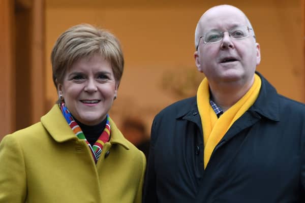 Former First Minister for Scotland and former leader of the Scottish National Party (SNP), Nicola Sturgeon, stands with her husband husband Peter Murrell.   (Photo by ANDY BUCHANAN / AFP) (Photo by ANDY BUCHANAN/AFP via Getty Images)