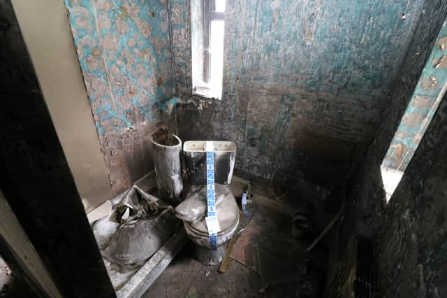 A house of horrors where potential buyers are banned from viewing it in person and the loo is taped off with ‘do not use’ labels is set to go under the hammer.