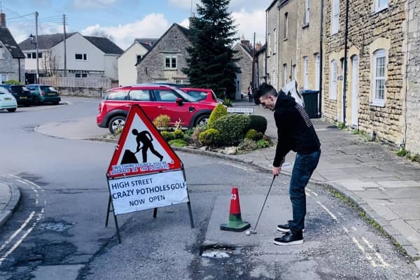 Ben Thornbury demonstrating 'crazy pothole golf' in Malmesbury