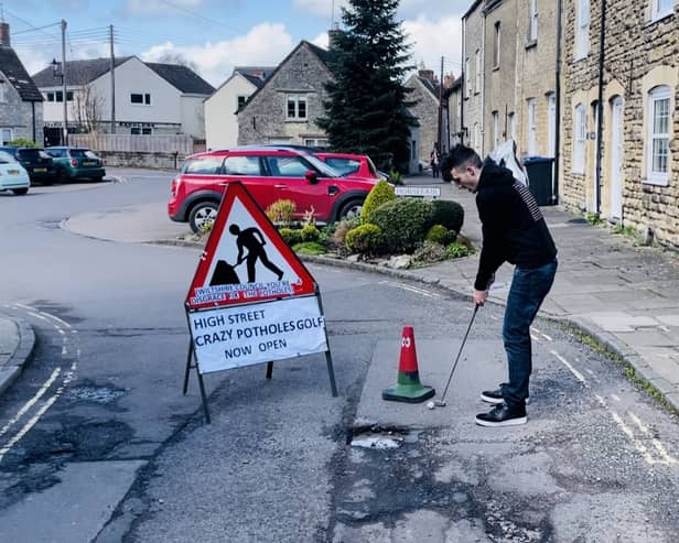 Ben Thornbury demonstrating 'crazy pothole golf' in Malmesbury