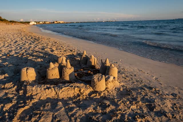 Strict beach laws in Benidorm could see visitors fined £130 for building a sandcastle (Photo: Adobe)