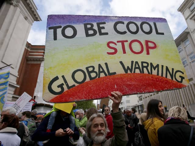 Scientists and science enthusiasts gather prior to the start of the 'March for Science' which celebrates the scientific method outside the Science Museum in central London on April 22, 2017, Earth Day
