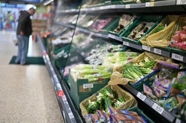 A shopper browses for fruit and vegetables in a Tesco supermarket in London on December 14, 2020 (Getty Images)