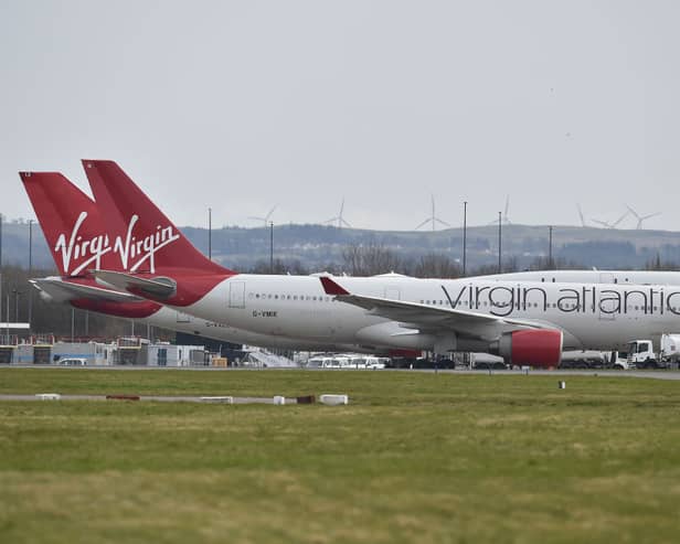 Virgin Atlantic planes sit on the runway at Glasgow Airport.
