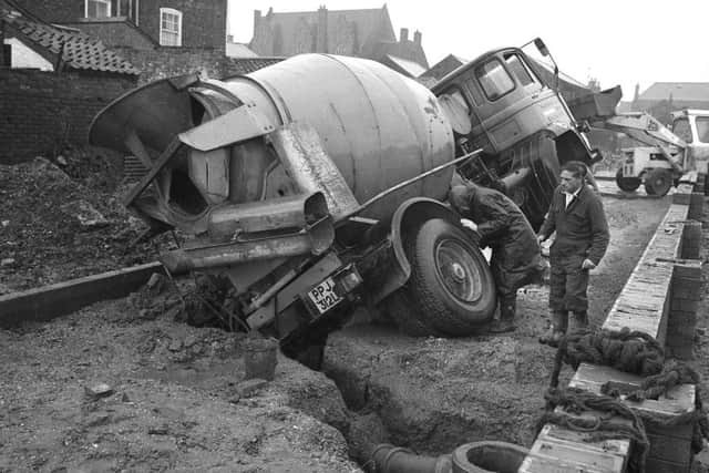 February, 1977 - A cement mixer in what is today Quaker Lane finds itself in a sticky situation during the construction of John Adams Way.