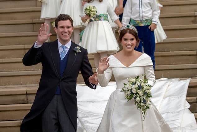 WINDSOR, ENGLAND - OCTOBER 12: Princess Eugenie and Jack Brooksbank leave St George's Chapel in Windsor Castle following their wedding on October 12, 2018 in Windsor, England. (Photo by Steve Parsons - WPA Pool/Getty Images)