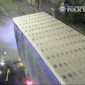 The car is seen smashing into the lorry.