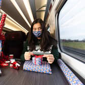 Professional gift wrapper Finn Drumgoole wraps presents for LNER customers to launch the rail operators complimentary Rail Wrapping service (photo: David Parry/PA Wire)