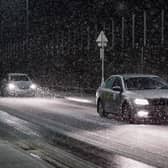 Motorists drive through a heavy snow shower as it passes over Saltburn By The Sea as Storm Arwen sweeps across parts of the country on November 26, 2021 (Photo: Getty)