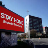 A giant television over the A57 Motorway urges people to stay home on March 26, 2020 in Manchester, England. (Getty Images)