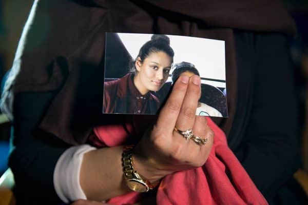 Renu Begum, eldest sister of Shamima Begum, holds her sister’s photo as she is interviewed by the media at New Scotland Yard in 2015 (Photo: Laura Lean - WPA Pool/Getty Images)